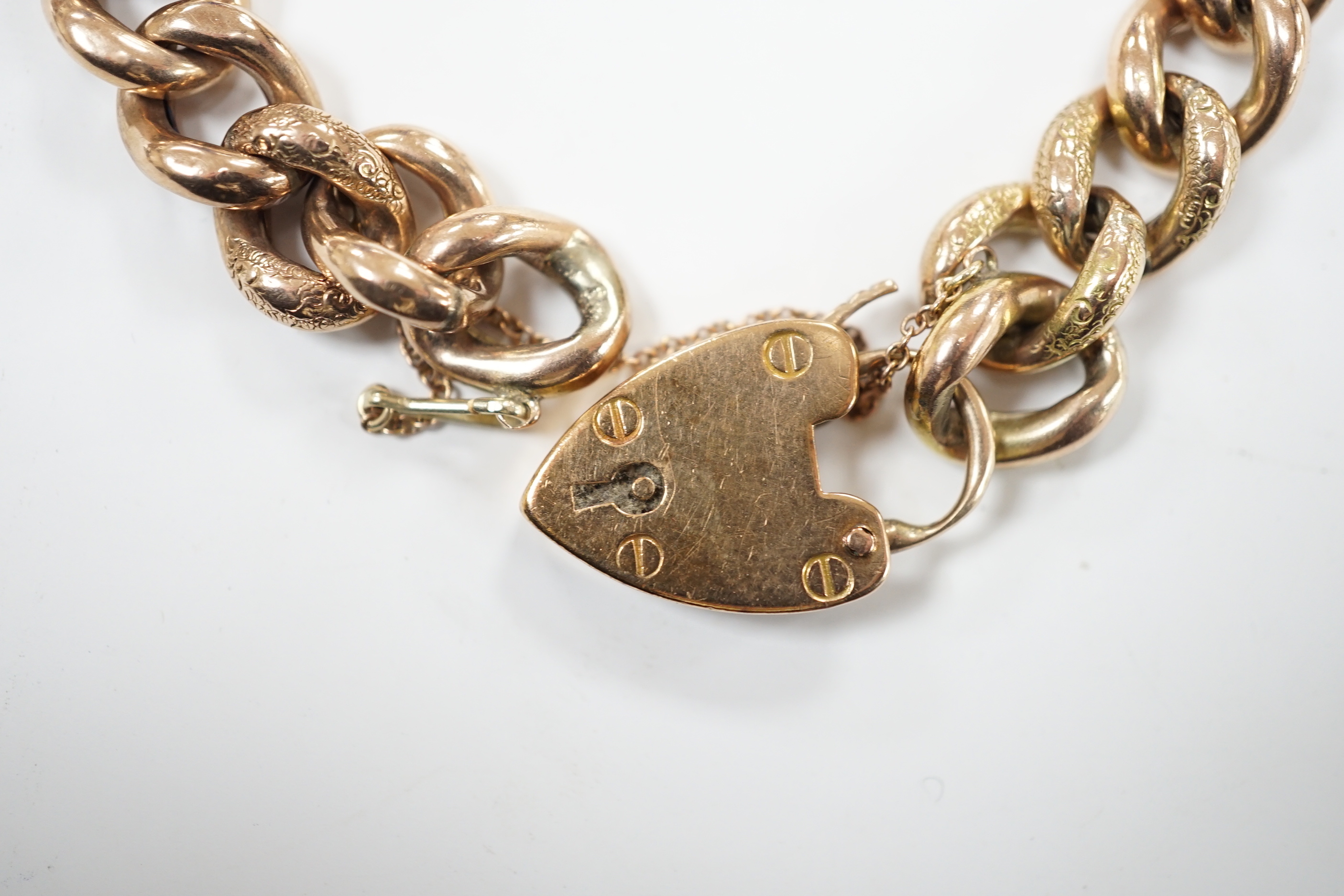A 9ct curblink bracelet, with padlock clasp, 19cm, 22.6 grams and a 19th century brooch(a.f.)